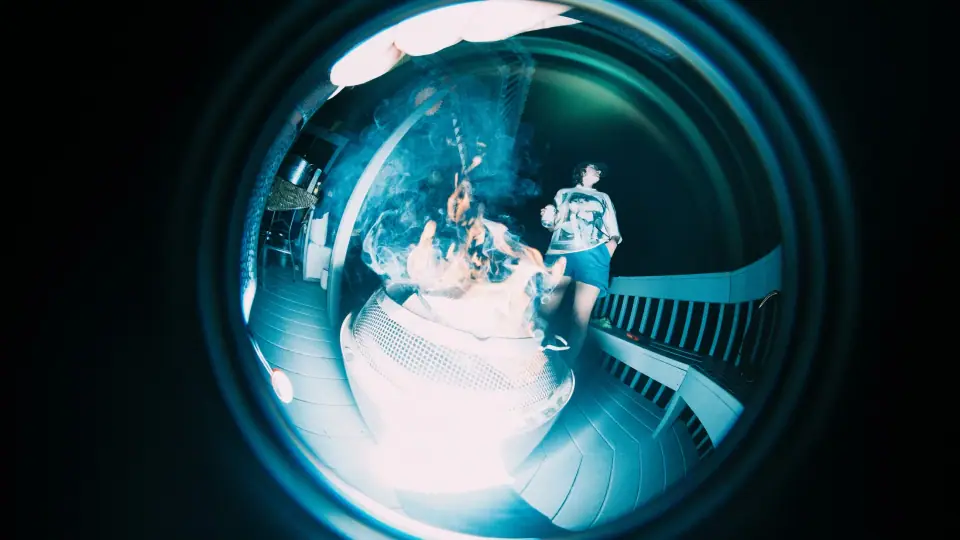 A scene distorted into a blue circular form.