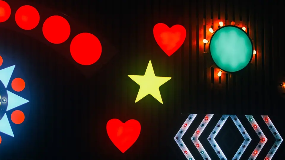 Saturated symbols are arranged against a black background.