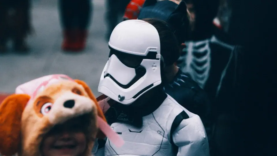 Costumes overlap within a tightly cropped street scene.