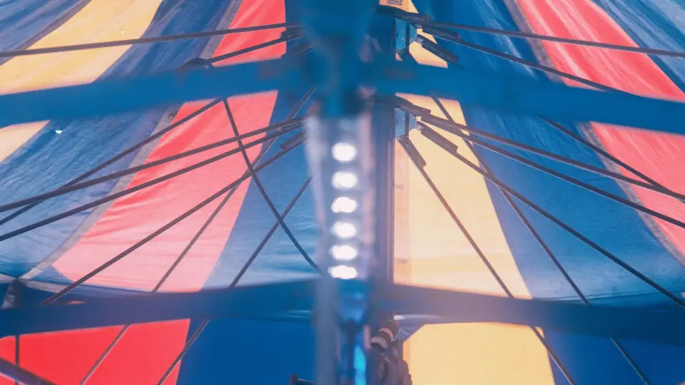 Colored canopy panels meet hard-edged shadows.
